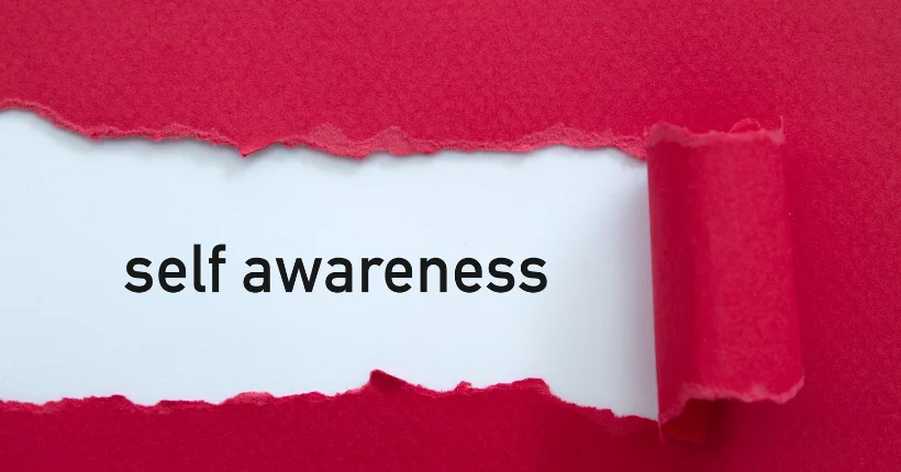 Professional reflecting thoughtfully on personal strengths and work preferences for career development