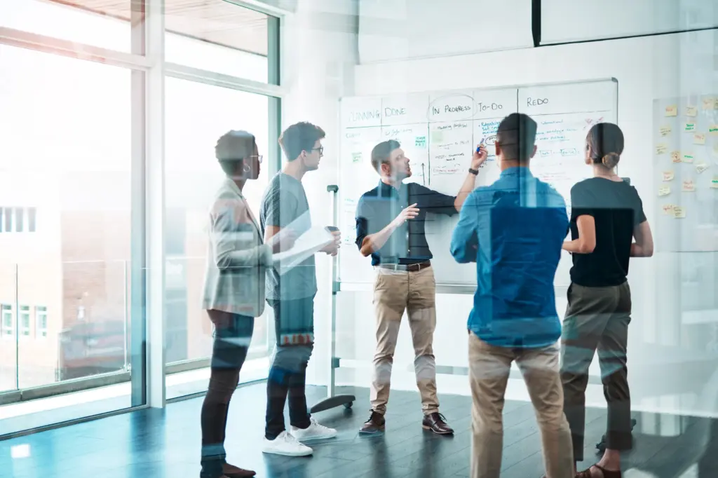 A diverse team of professionals collaborating in a bright office space