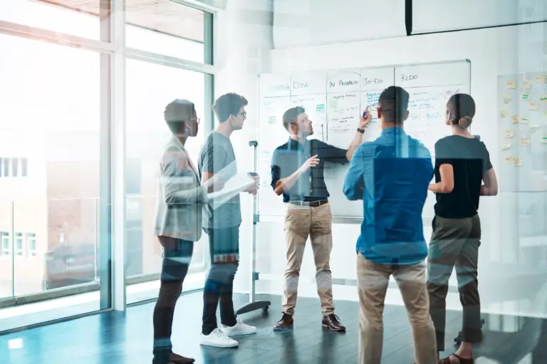 A diverse team of professionals collaborating in a bright office space